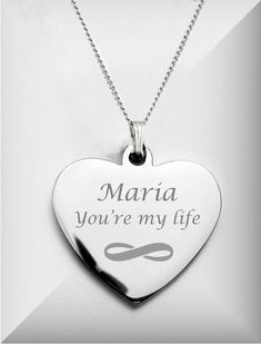 "This personalized silver heart pendant necklace is a great gift for that special someone. Our engraved heart necklaces can be personalized with your message including names and dates. Both sides of the heart pendant can be engraved. DIMENSIONS: 1 inch wide x 1 inch tall Material: High Polished Surgical Stainless Steel How To Send Engraving Instructions: When you are ready to order click ADD TO CART. During checkout fill out the ADD A NOTE section with your engraving instructions. You can also s Personalized Heart Necklace With Engraving For Mother's Day, Personalized Heart Necklace With Engraving For Valentine's Day, Valentine's Day Engravable Heart Necklace For Personalized Gift, Personalized Engraving Heart Necklace For Mother's Day, Personalized Engraved Heart Necklace For Valentine's Day, Personalized Heart Necklace With Engraving Option, Customizable Silver Heart Necklace For Wedding, Personalized Heart Necklace For Wedding Gift, Personalized Silver Heart Necklace With Engraving Option