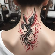 a woman's neck with a bird tattoo on the back of her neck and behind it is a white t - shirt