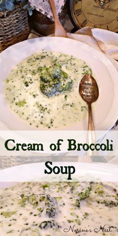 a bowl of cream of broccoli soup next to a plate with bread on it