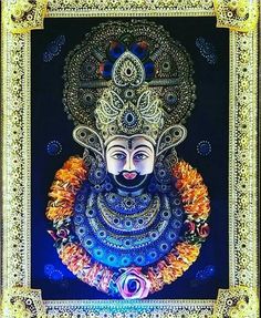 an ornately decorated statue in the middle of a frame