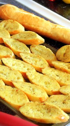 bread sticks and other food items on a tray