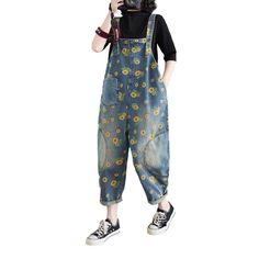 Bringing you the ultimate statement piece from the 2023 Spring-Summer Collection ââ‚?the sunflower painted patched denim overall! Crafted to embody the spirit of y2k style. these overalls feature an edgy distressed pattern. a loose fit. and suspenders closure ââ‚?perfect for any occasion!Why They're Your Next Y2K StapleFeaturing unique sunflower patches and a subtle paint pattern. these overalls bring out the perfect blend of contemporary fashion and nostalgic y2k vibes. They exude an effortless Summer Denim Blue Patchwork Jeans, Summer Patchwork Denim Blue Jeans, Summer Patchwork Relaxed Fit Jeans, Relaxed Fit Patchwork Jeans For Summer, Summer Floral Print Cotton Overalls, Trendy Summer Relaxed Fit Shortalls, Casual Summer Floral Print Overalls, Trendy Spring Overall Shortalls, Spring Cotton Denim Blue Shortalls