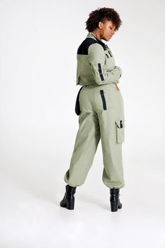 "Let them catch your vibe wearing this edgy pant set with matching jacket. This combo is crafted with cotton, mixed with denim, and designed with three pockets on the jacket, and three pockets on the pants, Cargo style! The jackets design is color blocked for that edginess it brings and the pants has a unique outer pocket on the left front and a half belt closure. Pair up this outfit with a cute bandeau top, or bodysuit and combat boots, Make all your friends wish they had this set too. All of o Cotton Hooded Sets With Pockets, Winter Utility Cargo Pants With Hip Pockets, Winter Techwear Cotton Cargo Pants, Combat Cotton Pants With Functional Pockets, Winter Streetwear Sets With Pockets, Fitted Cargo Pocket Outerwear For Streetwear, Fitted Outerwear With Cargo Pockets For Streetwear, Fitted Cotton Cargo Pants With Functional Pockets, Trendy Cotton Parachute Pants For Winter