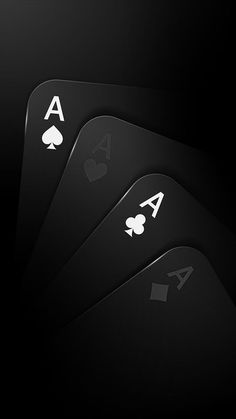 four playing cards with ace symbols on them in black and white colors, arranged in the shape of three spades