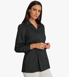 Unleash your confidence with our Diamond Tuck Shirt. Made from organic cotton poplin, this shirt features a flattering V-neckline and unique diamond tucks at the waist for a modern touch. Perfect for any occasion, this versatile style will be your new go-to! This is a limited production item produced in small quantities. If your selected size is currently sold out and pre-order is available, pre-order yours today to be first on the list for our next shipment. Versatile V-neck Work Shirt, Versatile V-neck Workwear Shirt, Classic Cotton V-neck Shirt, V-neck Cotton Shirt For Work, Classic V-neck Cotton Shirt, Formal Cotton V-neck Blouse, Relaxed Fit V-neck Office Shirt, Cotton V-neck Tops For Business Casual, Tencel Denim