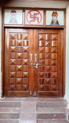 two wooden doors with decorative designs on them