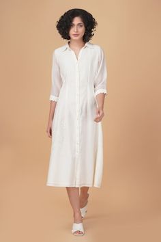 Ivory cotton chanderi shirt dress with tonal azisai floral and cross stitch embroidery. - Aza Fashions Elegant Off White Cotton Kurta, Elegant White Linen Kurta, Cream Cotton Straight Kurta Dress, Traditional White Linen Dress, Off White Cotton Straight Kurta Dress, Elegant Chikankari Embroidery Dresses For Daywear, Elegant Chikankari Embroidery Day Dress, White Kurta For Spring Daywear, Elegant Daywear Dress With Chikankari Embroidery