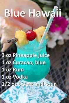 a blue hawaiian drink with pineapple juice and cherries