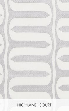 the back side of a white and grey wallpaper with wavy lines in different sizes