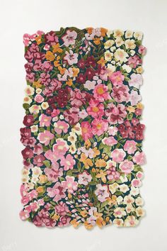 a piece of paper with flowers on it and green, pink, yellow and red colors