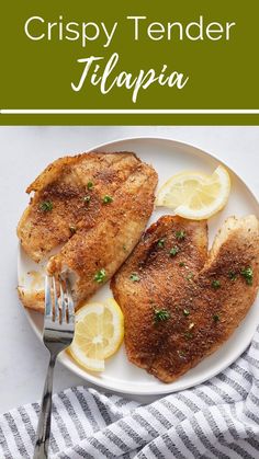 two pieces of chicken on a plate with lemons and parsley