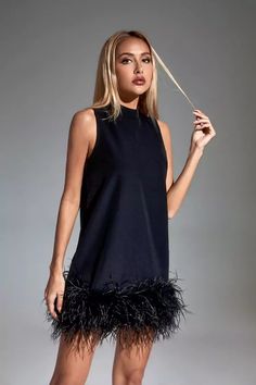 Add the adorable must-have Hope Black Feather Mini Dress! The sleeveless straight style design with a half-high collar adds a fashionable sense of luxury. The feathers are dotted under the dress, which looks fluffy and cute. Put on high heels or boots to create a unique look that belongs to you.  Dress Length: Approx 72cm Materials: 70% Polyester, 30% Cotton Gentle Dry Clean Only  Model is 5 ft 7 and wears size S  Colour may vary due to lighting on images. The product images (without model) are Feather Mini Dress, Blazer Mini Dress, Womens Trendy Dresses, Sequin Maxi Dress, Feather Dress, Dress Store, Black Feathers, Lovely Dresses, Floral Mini Dress