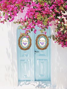 there are two blue doors with flowers on the outside and one has a sign that says happy birthday