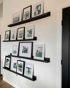 several black and white pictures are hanging on the wall