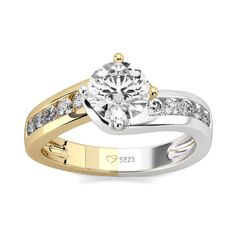 a yellow and white gold engagement ring with diamonds on the side, set in two tone gold