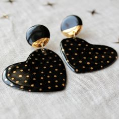 black and gold heart shaped earrings with polka dots