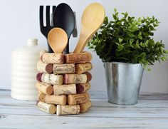 a stack of wine corks with wooden utensils