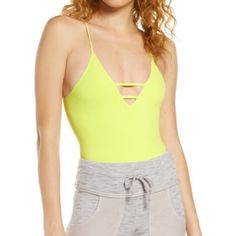 New Yellow Free People V Neck Bodysuit Spring Workout Casual Bodysuit, Spring Workout Athleisure Bodysuit, Sporty Bodysuit For Beach In Spring, Summer V-neck Workout Bodysuit, Summer Workout Bodysuit In Trendy Style, Trendy Summer Workout Bodysuit, Summer Workout V-neck Bodysuit, Chic Summer Workout Bodysuit, Yellow Casual Bodysuit For Spring