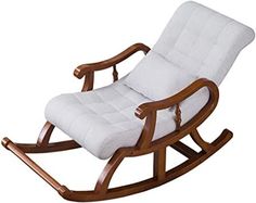 a wooden rocking chair with white fabric on the back and seat cushion, in front of a white background