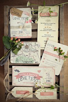 wedding stationery in an old crate with flowers