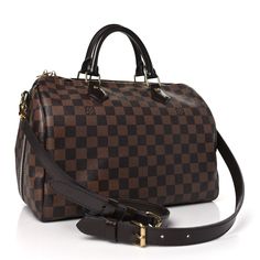 This is an authentic LOUIS VUITTON Damier Ebene Speedy Bandouliere 30. This timeless tote is crafted of Louis Vuitton's signature Damier coated canvas in brown. The handbag features dark brown rolled leather top handles, matching trim, and an optional, adjustable shoulder strap with polished brass hardware. The top zippers open to a rouge red fabric interior with a hanging zipper pocket. Speedy Bandouliere 30, Speedy Bandouliere, Louis Vuitton Damier Ebene, Damier Ebene, Red Fabric, Brass Hardware, Polished Brass, Leather Top, Authentic Louis Vuitton