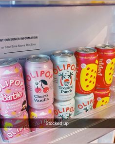 a refrigerator filled with lots of different types of sodas