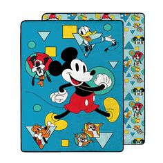 the mickey mouse towel is on display in front of an image of other cartoon characters