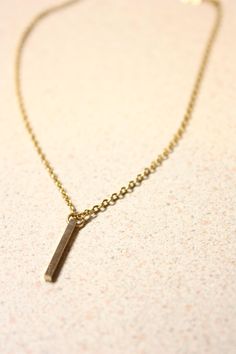 Dainty Bar Necklace. A small gold tone brass bar charm dangles a stainless steel curb necklace. A daily casual wear necklace. 16.50 inch chain. Spring clasp closure. Dainty Bar Necklace, Brass Bar, Stainless Steel Bar, Wear Necklaces, Steel Bar, Bar Necklace, Halloween Shopping, Charm Necklace, Necklace Etsy