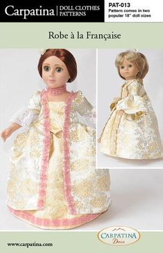 the doll is wearing a dress and bonnet