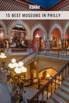 the inside of a building with stairs and paintings on the walls, along with lights