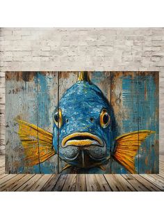 a blue fish painted on wood with yellow eyes