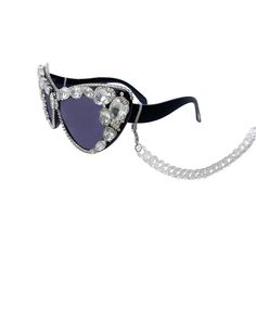 These dramatic rhinestone face sunglasses will make you look and feel oh, so ultra-fabulous- the compliments will be endless! These plastic frames have flamboyant cat eye shaped lenses and feature all-over hand embellishment with prong set rhinestone crystals around the frame. The lens is tinted from light to dark and the stems feature a clear removable plastic chain neck strap. Each pair is one-of-a-kind and as unique you are. You will turn heads like never before when you wear these show-stopp Party Sunglasses With Anti-reflective Glass, Silver Shield Sunglasses With Uva Protection For Party, Clear Cat Eye Sunglasses With Uv Protection For Parties, Party Cat Eye Sunglasses With Clear Glass, Party Clear Cat Eye Sunglasses With Mirrored Lenses, Clear Cat Eye Sunglasses For Party, Party Clear Cat Eye Sunglasses, Clear Sunglasses With Uv Protection For Parties, Party Cat Eye Shield Sunglasses With Anti-reflective Coating