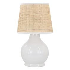 a white table lamp with a beige shade on the top and bottom part of it