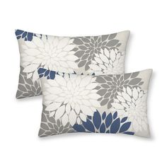 two pillows with blue and white flowers on them