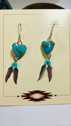 *Brand New * Handmade item *925 Sterling silver * Gemstone: Kingman Turquoise * Heart 2 feathers Earrings *Dangle drop Earrings *Free gift box *Free shipping in USA *Ready to ship *Thank you for looking and check out more items in my Etsy shop for more great items and deals! *Https://www.etsy.come/shop/abq925 Turquoise Heart Beads Dangle Earrings, Turquoise Dangle Earrings With Heart Beads, Southwestern Heart Jewelry Gift, Turquoise Heart Drop Earrings As Gift, Handmade Turquoise Jewelry For Valentine's Day, Feathers Earrings, Heart Earring, Earring Handmade, Turquoise Bead Necklaces