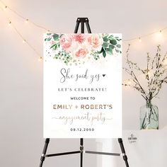 an easel with a sign that says, she said yes let's celebrate welcome to family and roberts engagement party