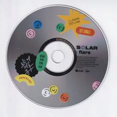 a cd with various stickers on it