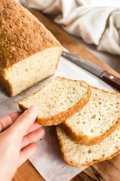 a loaf of bread sitting on top of a cutting board