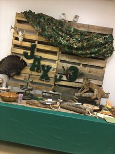 a table topped with lots of different types of food on top of wooden pallets