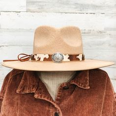 Brown cow print hat band with a single silver stone cluster. It also has leather like material strands that tie it together. It is laying on a piece of wood that is pictured of a white background. Adjustable Silver Hat Band For Rodeo, Silver Adjustable Hat For Rodeo, Western Adjustable Silver Hat Band, Adjustable Silver Fedora Hat, Western Style Silver Adjustable Hat Band, Cow Print Hat, Western Hats For Women, Cowboy Hat Crafts, Burned Hats