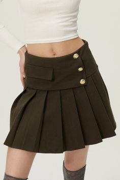 Shop Mila Gold Button Pleated Skort at storets. Buy Now Or Cry Later. Shop skirts, skorts, shorts, pants, jeans, leggings and more at storets. Style your look with the trendiest bottoms we have at storets.