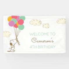 a happy birthday banner with a cartoon character holding balloons in the air and writing on it