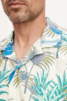 Hello vacation! A warm weather essential is the classic camp shirt and this is our take on this casual button down in a bold print that is just the right amount of eye-catching. A relaxed fit in a cotton woven. Green Printed Camp Shirt For Spring, Spring Printed Green Camp Shirt, Casual Patterned Camp Shirt For Spring, Summer Patterned Hawaiian Shirt, Casual Patterned Short Sleeve Shirt For Vacation, Casual Floral Print Camp Shirt, Patterned Casual Short Sleeve Shirt Relaxed Fit, Casual Patterned Relaxed Fit Short Sleeve Shirt, Casual Patterned Short Sleeve Shirt, Relaxed Fit