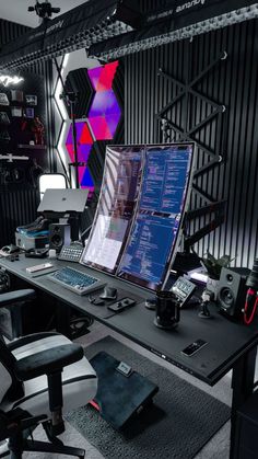 a computer desk with two monitors on it