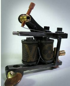 an old style tattoo machine with two coils