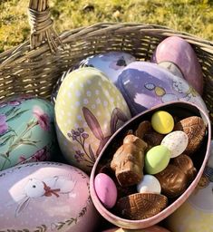 an easter basket filled with chocolate eggs and candies