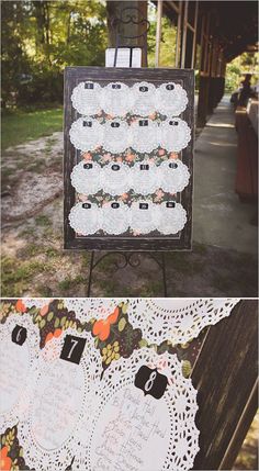 the wedding table numbers are laid out on an easel for guests to take pictures