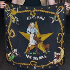 a woman holding up a star with the words always saddle your own horse