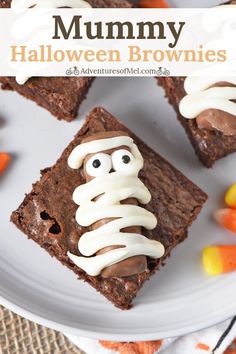 halloween brownies with white frosting and eyes on top are sitting on a plate