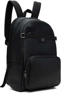 Grained faux-leather backpack in black. · Carry handle · Adjustable padded shoulder straps · Logo hardware and D-rings at face · Zip pocket · Luggage strap at padded back face · Zip compartment · Two-way zip closure · Two compartment interior · Laptop compartment at interior · Logo-woven satin lining · Logo-engraved gunmetal-tone hardware · H17 x W11 x D9 Supplier color: Black Black Leather Backpack With Gunmetal Hardware, Black Backpack With Gunmetal Hardware For Travel, Black Travel Backpack With Gunmetal Hardware, On-the-go Backpack With Gunmetal Hardware, Black Backpack With Gunmetal Hardware, Daily Use Backpack With Gunmetal Hardware, Black Backpack With Gunmetal Hardware For Daily Use, Interior Logo, Faux Leather Backpack